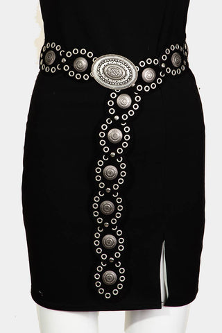 Black western belt with silver oval buckle, concho discs, and grommet trim