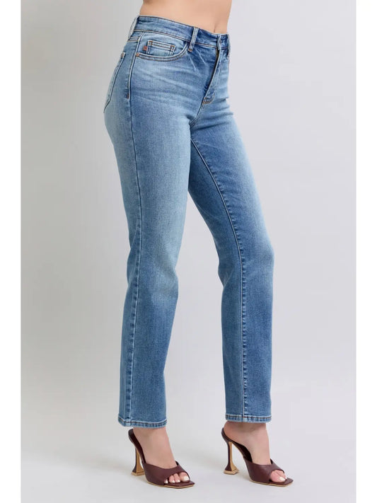 Light blue jeans worn by a person on a white background