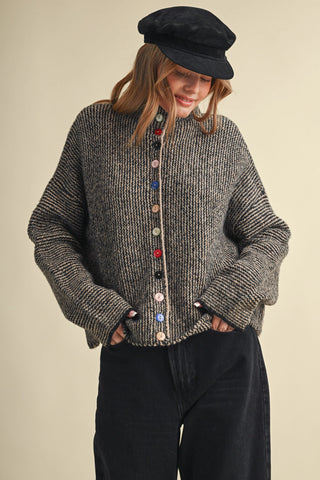 Black and taupe marled knit cardigan with colorful mismatched buttons down front