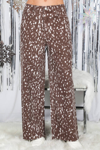 Wide-leg pants with white spotted animal print pattern, high-waisted with button closure