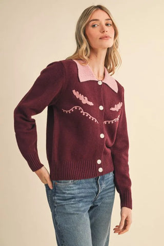 Burgundy western knit cardigan with pink collar and embroidered motifs, button front