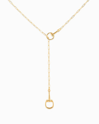 Gold necklace with a small pendant on a white background