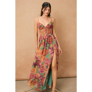 Woman wearing a colorful floral dress against a beige background