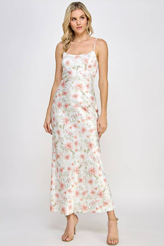 Woman wearing a floral dress on a white background