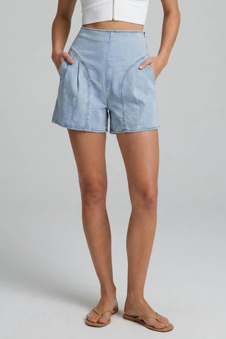 Woman wearing light denim shorts