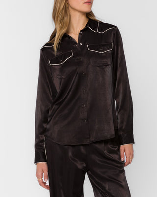 Black satin western shirt with white piping, snap buttons, and dual chest pockets