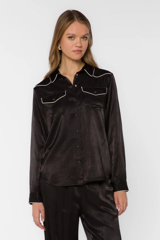 Black satin western shirt with cream piping, snap buttons, and dual chest pockets