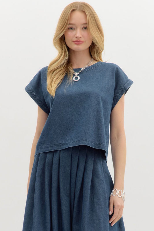Woman wearing a blue top and skirt set on a white background