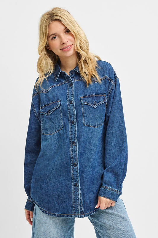 Woman wearing a blue denim shirt on a white background