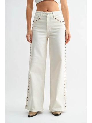 White wide-leg jeans with decorative elements on a white background