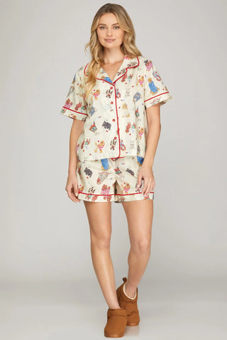 Woman wearing a pajama set with animal print on a plain background
