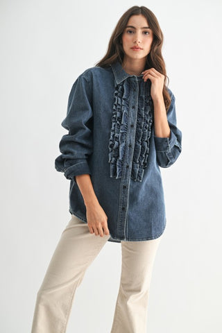 Woman wearing a denim jacket with ruffled details on a white background