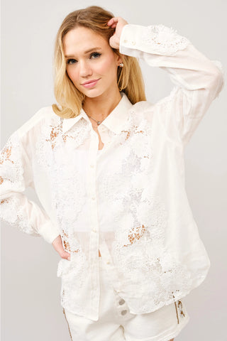 White off-white crochet lace button-up blouse with long sleeves and floral lace detailing