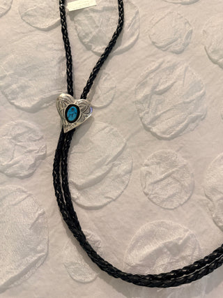 Heart-shaped sterling silver bolo tie with turquoise stone on black braided cord