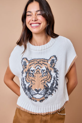 Ivory knit sweater vest with intarsia tiger face graphic and brown contrast trim