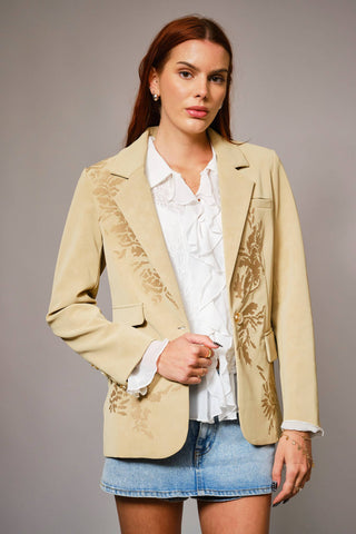 Woman wearing beige embroidered Blazer