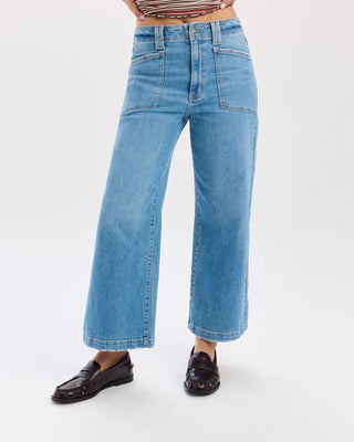 Wide-leg jeans worn by a person on a white background
