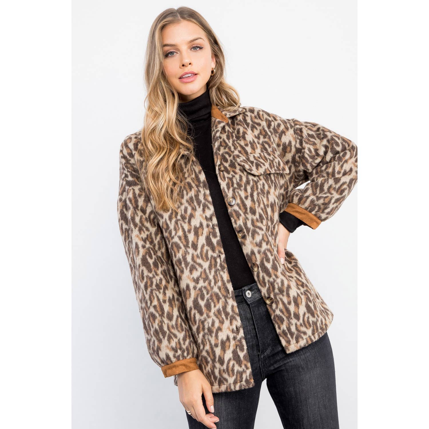 Woman wearing a leopard print jacket on a white background