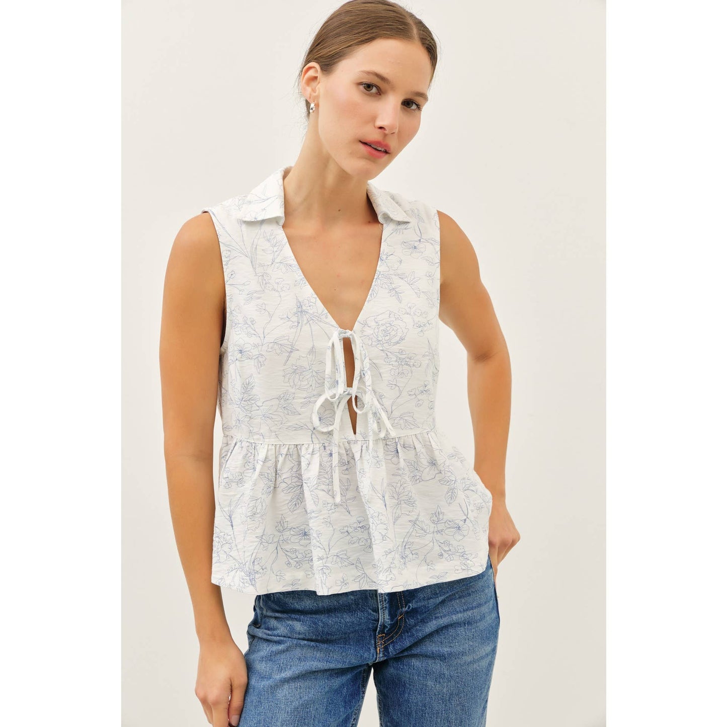 The Fancy Print Babydoll Blouse with Front Tie Detail