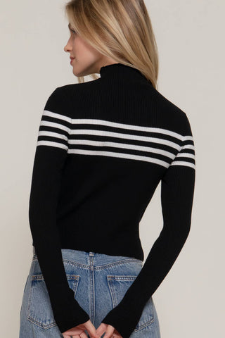 Black ribbed turtleneck sweater top with white chest stripes, long sleeves