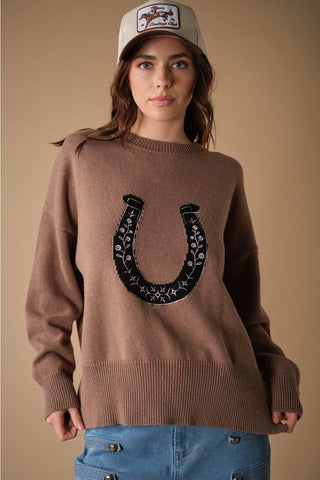 Mocha knit sweater with black floral embroidered horseshoe graphic and ribbed trim