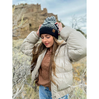Black and white Aztec pattern knit pom beanie with CC leather logo patch