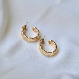 Gold-tone chunky hoop earrings with quilted diamond pattern and post backs