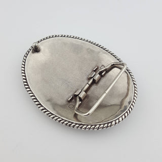 Back view of oval silver metal western belt buckle with rope edge detail