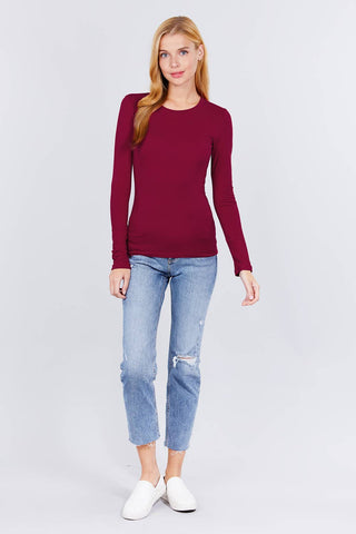 Women's burgundy long sleeve crew neck fitted cotton jersey top with jeans