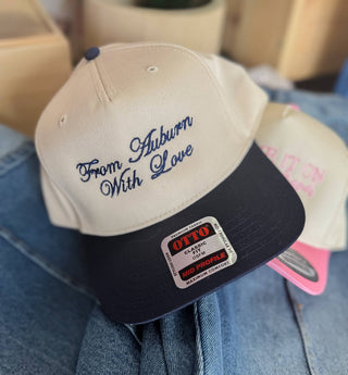 Ivory and navy snapback hat embroidered From Auburn With Love in navy script