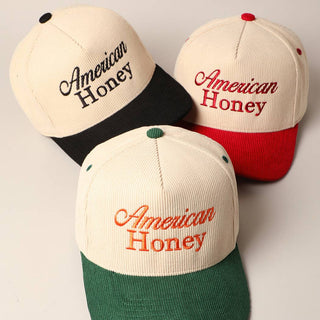 American Honey corduroy baseball caps in black, red, and green colorways