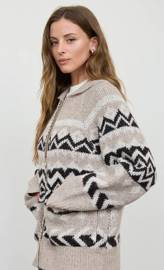 Side view of a zip-up collared knit cardigan with geometric zigzag fair isle pattern on a model