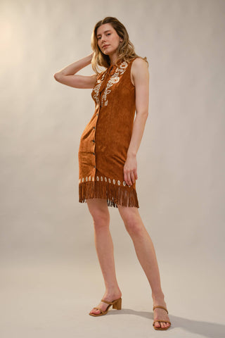 Tan suede sleeveless fringe mini dress with white embroidery and snap buttons