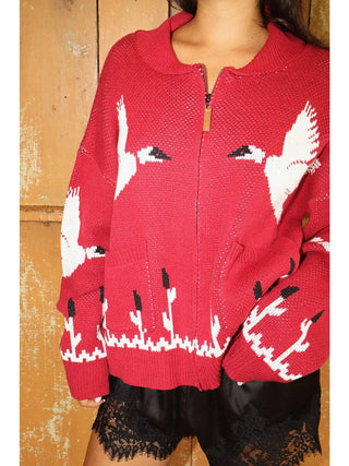 Red knit zip-up cardigan with white flying crane and cattail pattern
