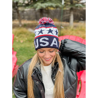 Navy USA knit pom beanie with red white stars stripes patriotic design