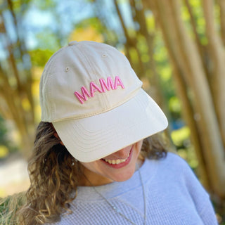 Cream cotton ball cap with pink embroidered MAMA lettering on front panel