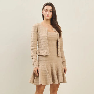 Beige textured knit ruffle-hem crop cardigan with button-front closure, long sleeves