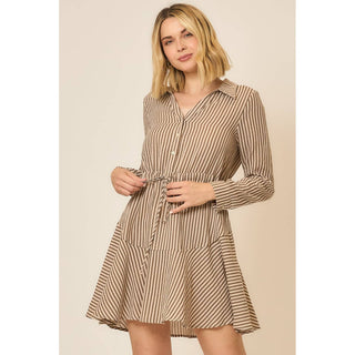 Model wearing a long-sleeve vertical stripe button-front shirt dress with tiered ruffle skirt and waist tie