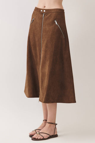 Midi-length brown suede A-line skirt with diagonal zipper pockets and snap waistband detail