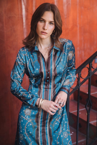 Model wearing a satin printed midi dress with collar, long sleeves, and button front detail