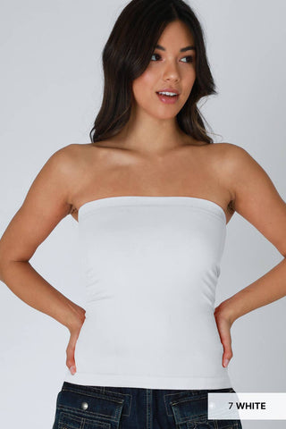 NIKIBIKI white two-layer strapless tube top paired with dark denim jeans