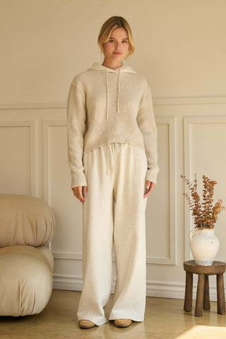 Cream wide-leg soft knit pants with drawstring waist, relaxed fit
