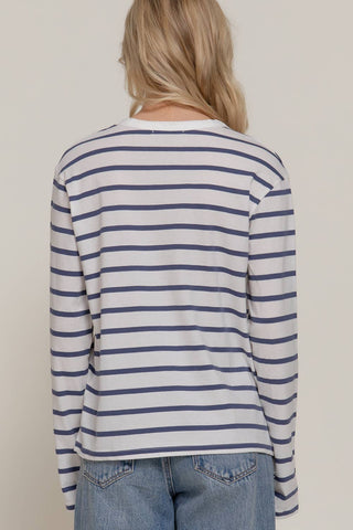 White and navy blue horizontal stripe long sleeve round neck tee, back view