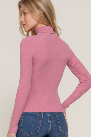 Women's pink ribbed turtleneck long sleeve fitted sweater, back view