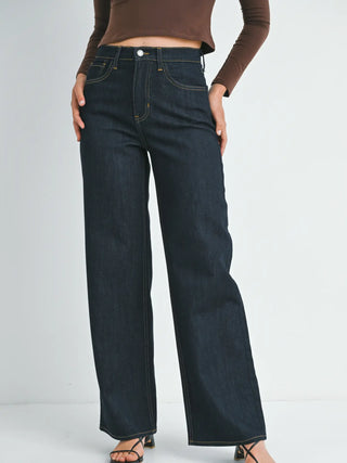 Dark indigo wide leg jeans with yellow contrast stitching and high waist fit