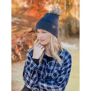 Navy blue C.C knit beanie with faux fur pom and smocked stitch pattern
