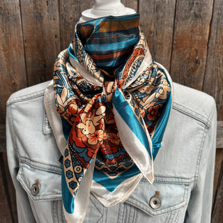 Teal cream paisley floral satin wild rag western scarf tied on denim jacket mannequin
