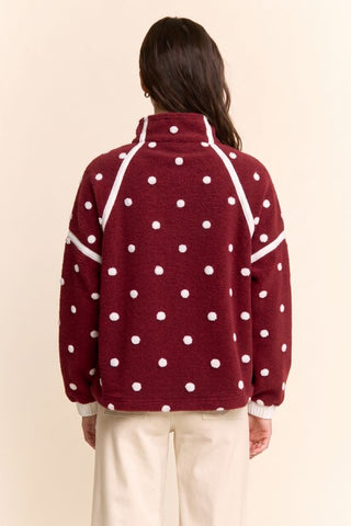 Wine red polka dot fleece half-zip pullover with white dots and stripe trim