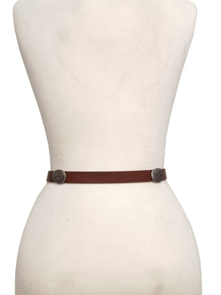 Axesoria West slim brown leather belt with silver engraved round conchos on mannequin
