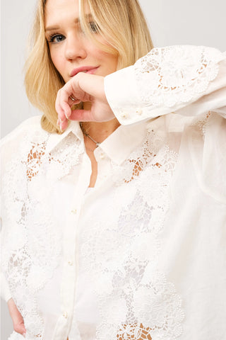 Off white crochet lace button-down blouse with long sleeves and floral cutout detail
